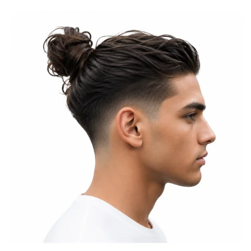 Low taper fade man bun hairstyle with tied-back hair and clean fade
