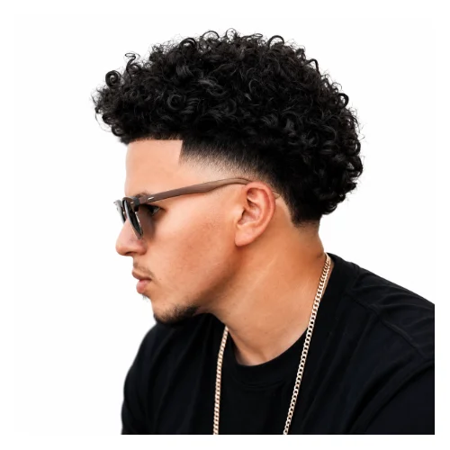 Curly fringe with low taper fade hairstyle featuring curls falling over the forehead, textured volume, and clean tapered sides for a trendy look