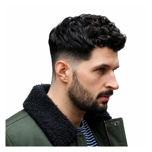 Modern low taper fade curly hair hairstyle featuring well-defined curls on top, balanced volume, and a clean low taper fade for a fresh contemporary look