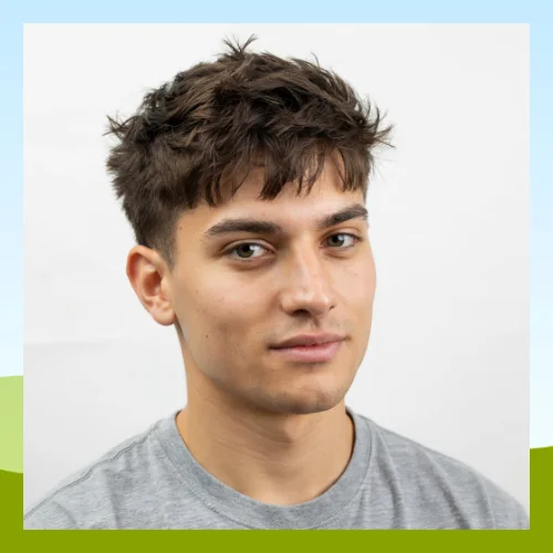 Spiky textured fringe hairstyle featuring short spiked texture on top, defined fringe detail, and a bold modern finish with added volume