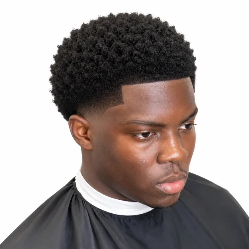 Man with a rounded afro and clean low taper fade