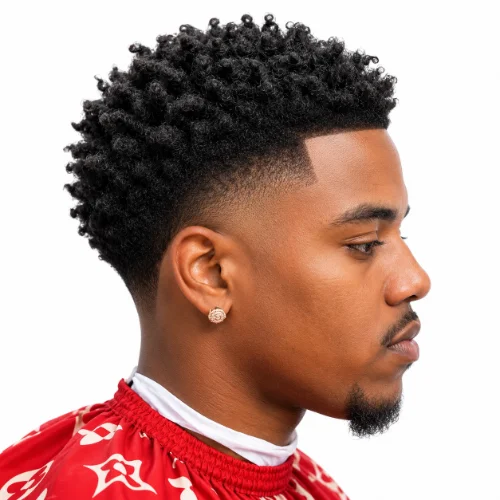 Man with a textured afro and low taper fade haircut