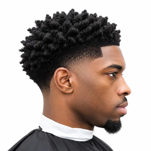 Man with a low taper fade afro styled using a twist sponge