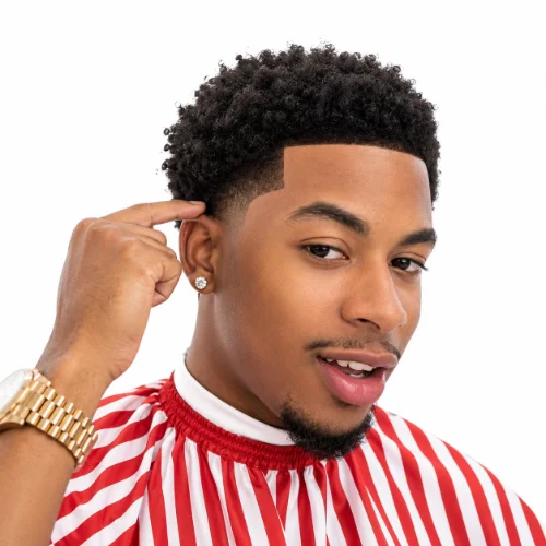 Man with a low taper fade afro and a sharp line up