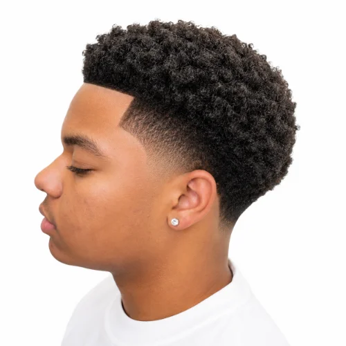 Man with a low taper fade afro and subtle temple fade