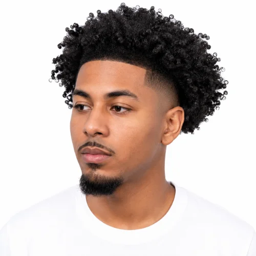 Man with a modern low taper fade and natural afro