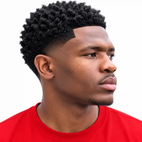 Man with a low taper fade afro and sharp edge up