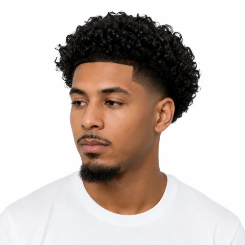 Black man with a clean low taper fade haircut on a white background.