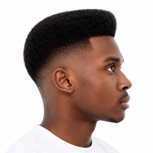 Black man with a classic low taper fade haircut featuring clean faded sides