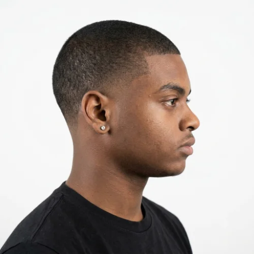 Black man with a buzz cut and low taper fade haircut