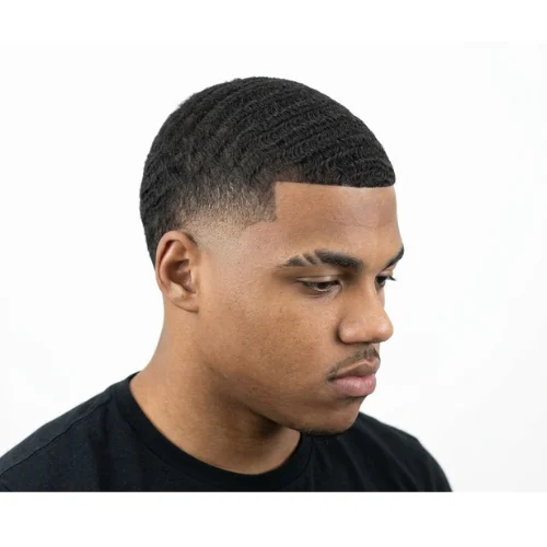 Black man with a mohawk and low taper fade haircut