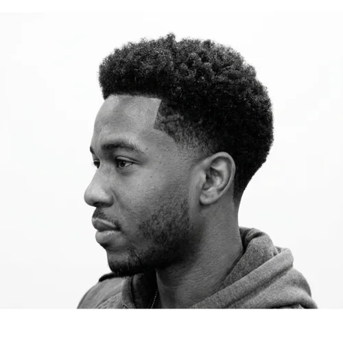 Black man with a professional low taper fade haircut