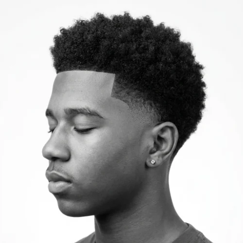 Teen boy with a stylish low taper fade black haircut