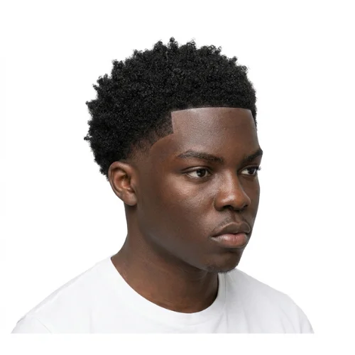 Black man with natural coils and a low taper fade haircut