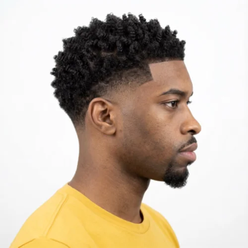 Black man with sponge twists and a low taper fade haircut