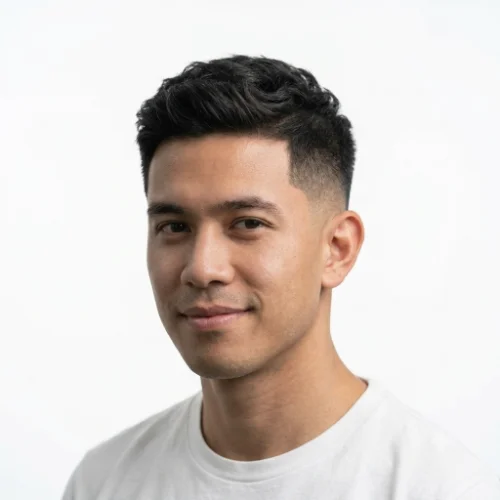 Man with a textured crop, sharp line up, and low taper fade