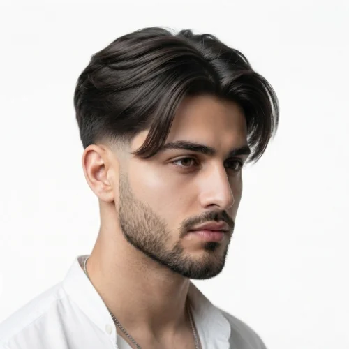 Man with a modern low taper fade middle part featuring clean sides and stylish textured hair on a white background.