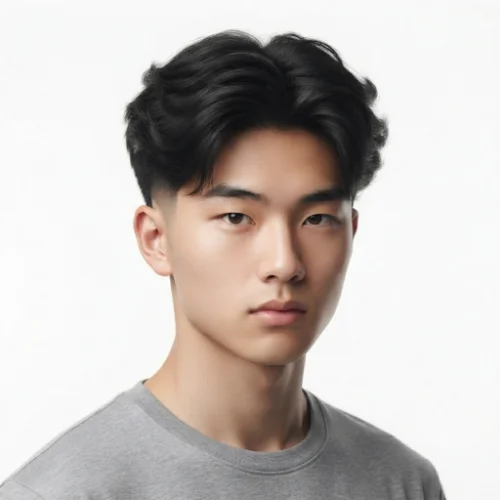 Asian man with a stylish low taper fade blowout featuring natural volume and clean faded sides on a white background.
