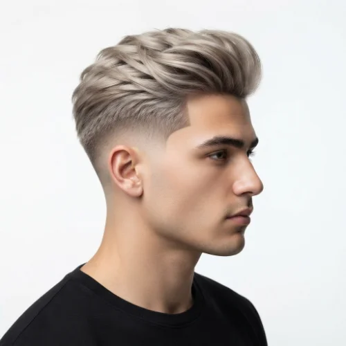 Man with long blonde hair and a low taper fade featuring a textured top on a white background.