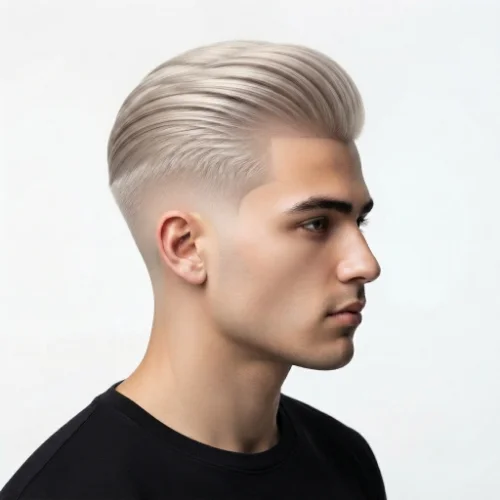 Man with long slicked-back hair and a low taper fade featuring clean sides on a white background.