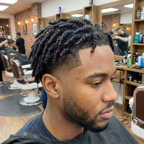 Modern low taper fade twists hairstyle for men