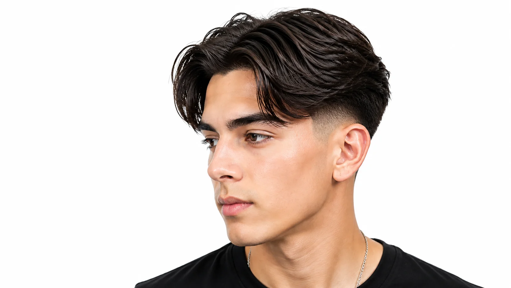 Man with a low taper fade middle part hairstyle featuring clean faded sides and naturally parted hair on a white background.